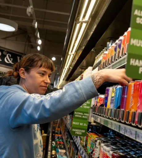 woman purchasing thc beverage